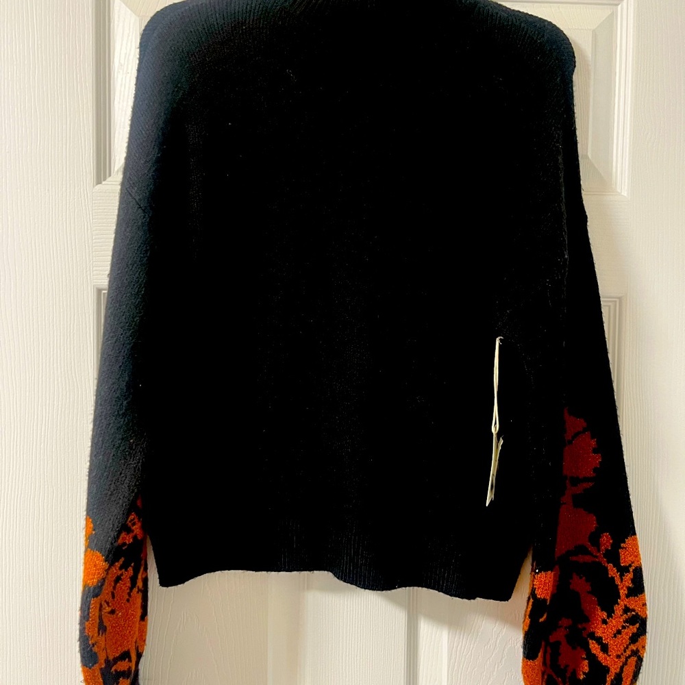 Brand new balloon sleeve sweater with adorable print on the sleeves.